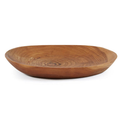 El plato orgánico de raíz de teca