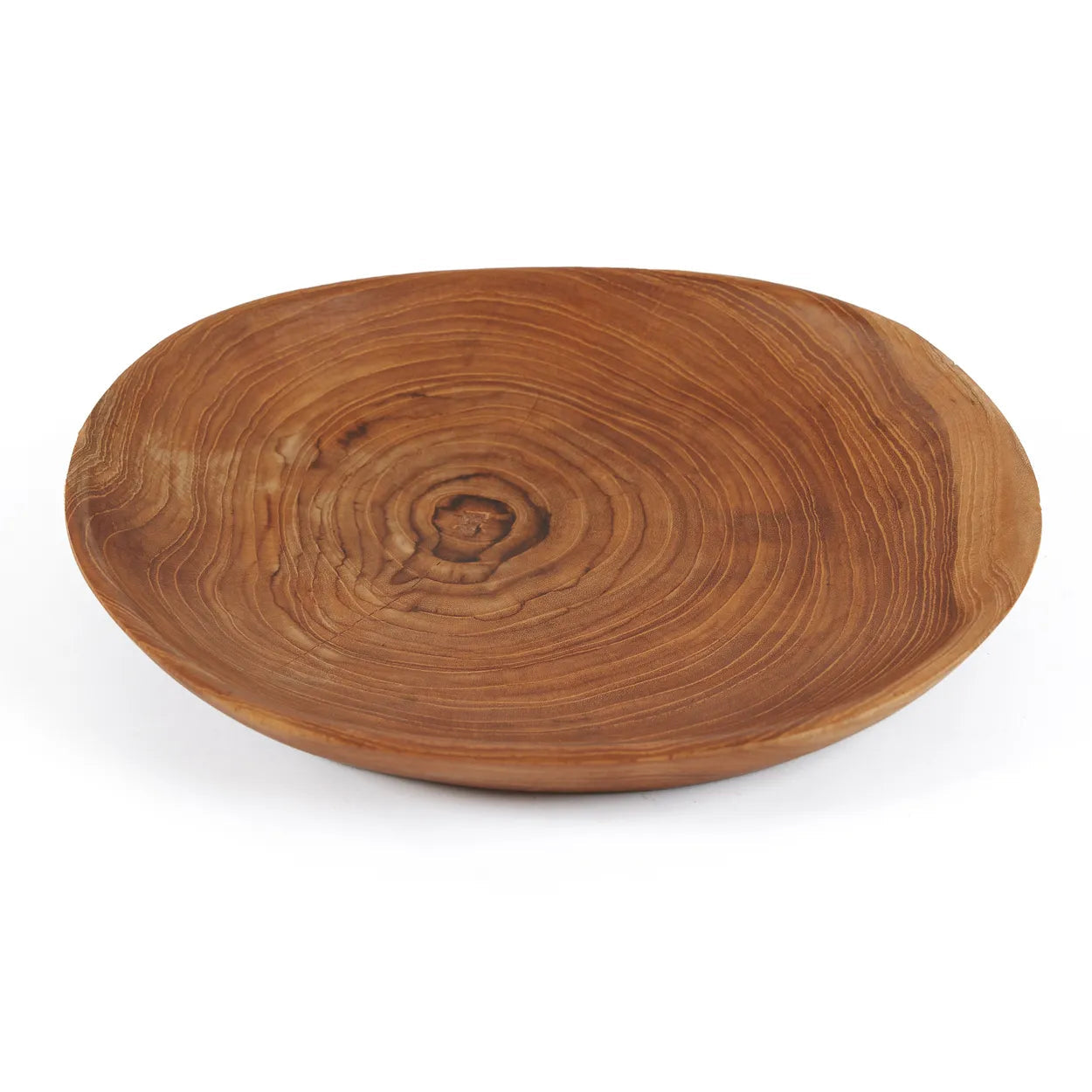 El plato orgánico de raíz de teca
